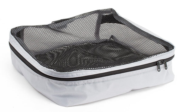 An empty and zipped closed Northwest Sky (light grey) Aether Large Aeronaut 30 Packing Cube.